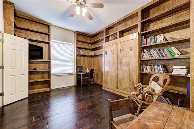 office with dark hardwood / wood-style floors and ceiling fan