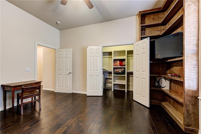 interior space featuring ceiling fan, a closet, and dark hardwood / wood-style floors