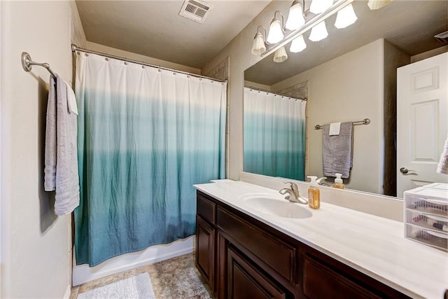 bathroom featuring vanity and shower / tub combo with curtain