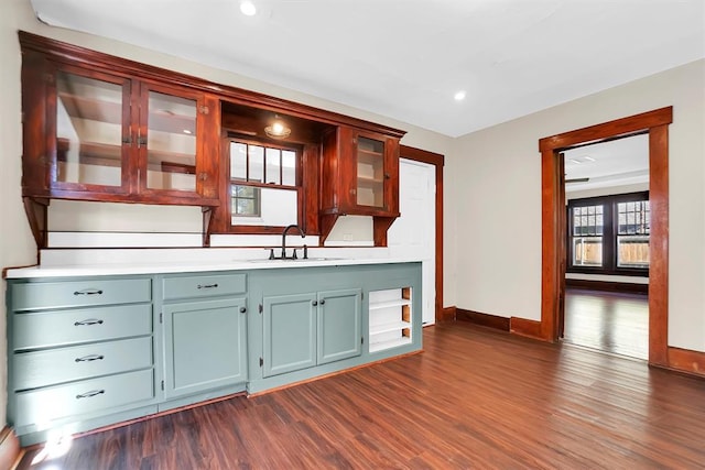 kitchen featuring a wealth of natural light, dark hardwood / wood-style flooring, and sink