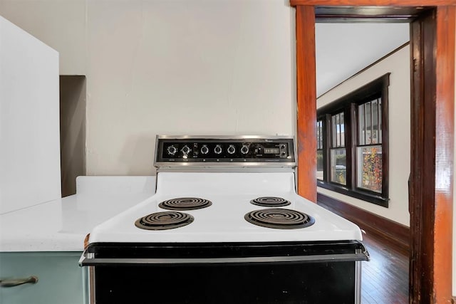 kitchen with white range with electric stovetop and dark hardwood / wood-style flooring