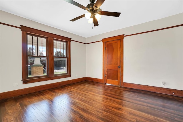 empty room with ceiling fan and hardwood / wood-style flooring