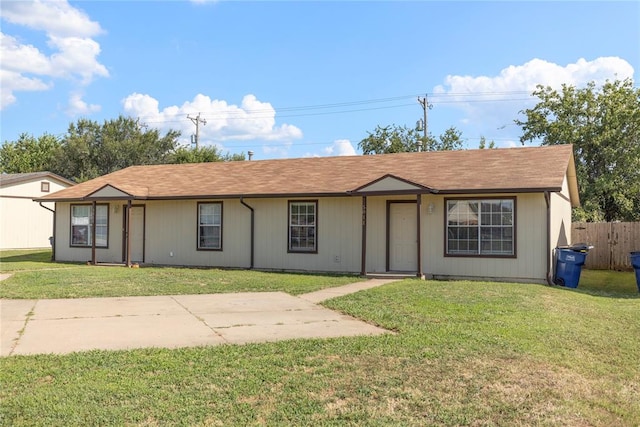 ranch-style house with a front lawn