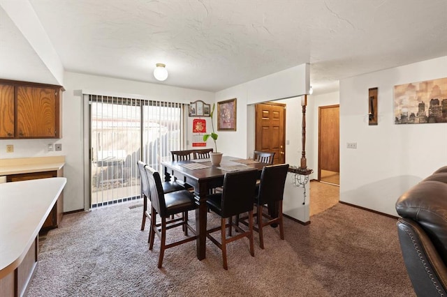 view of carpeted dining area