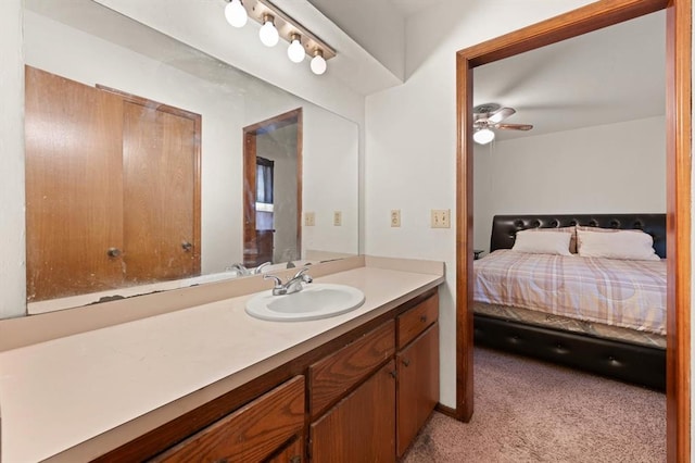 bathroom with ceiling fan and vanity