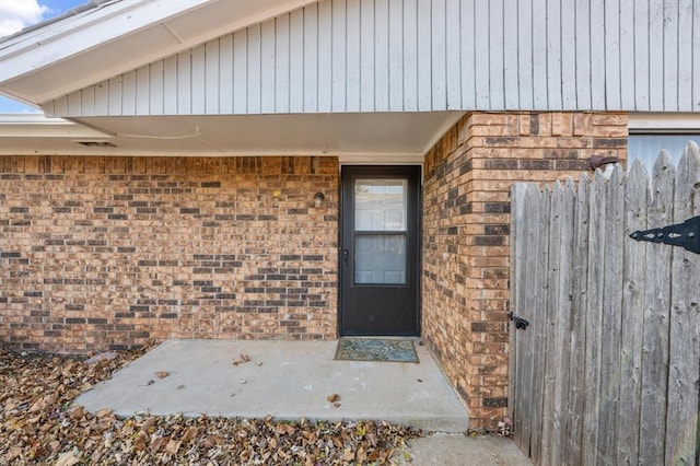 8207 NW 78th St Unit 2, Oklahoma City, OK 73132 - view of exterior entry with brick siding