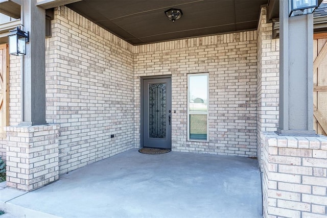 doorway to property with a porch