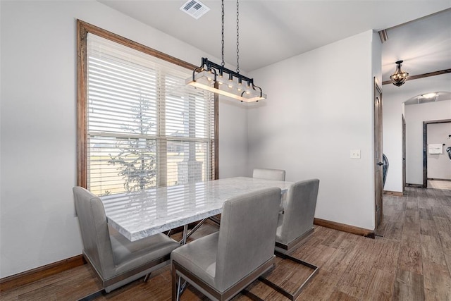 dining area featuring wood-type flooring