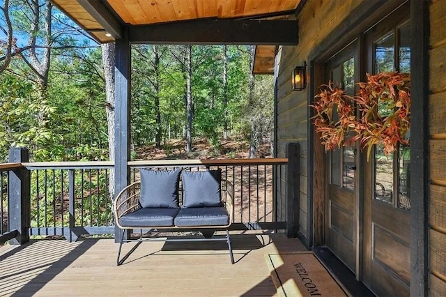 sunroom with wood ceiling and vaulted ceiling