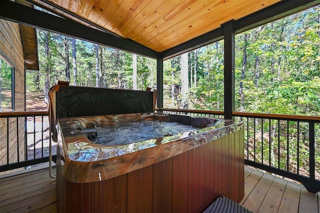 wooden terrace featuring a hot tub