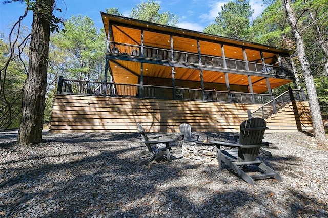 back of house featuring a balcony