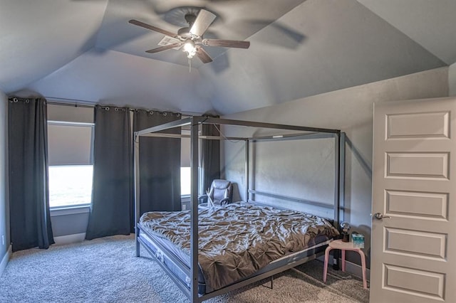 bedroom with carpet floors, vaulted ceiling, and a ceiling fan