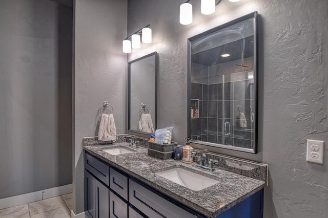 bathroom featuring vanity, tile patterned floors, and a shower with door