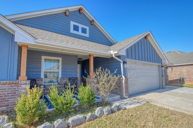 craftsman-style house featuring a garage and a porch