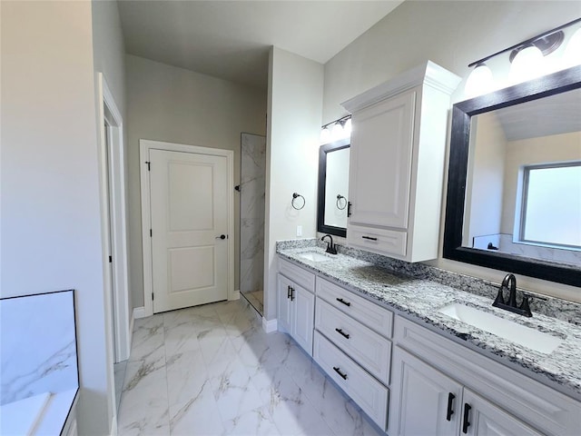 bathroom with vanity and a shower