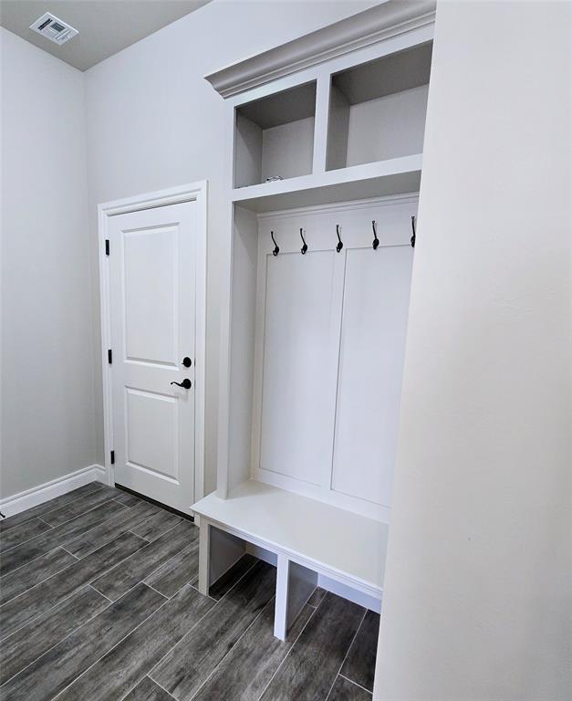 mudroom with dark wood-type flooring