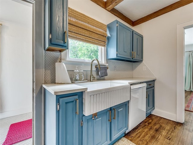 kitchen featuring dishwasher, dark hardwood / wood-style floors, blue cabinets, and tasteful backsplash