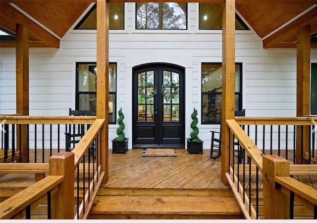 entrance to property with a deck and french doors