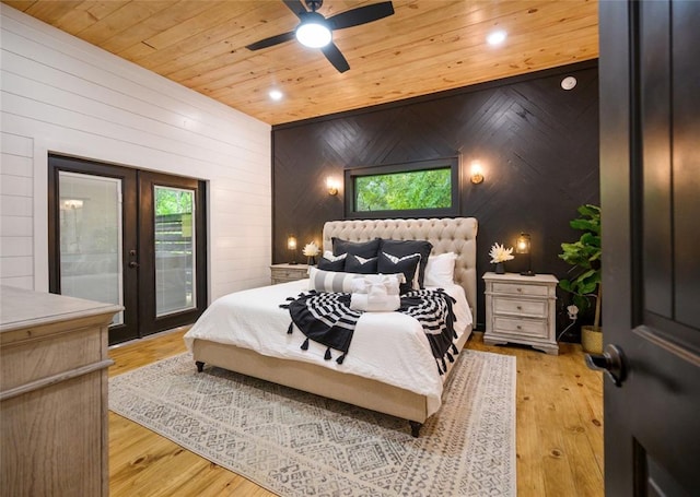 bedroom with french doors, light hardwood / wood-style floors, ceiling fan, and wood ceiling