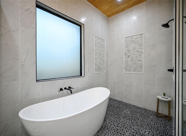 bathroom featuring wood ceiling, tile walls, and independent shower and bath