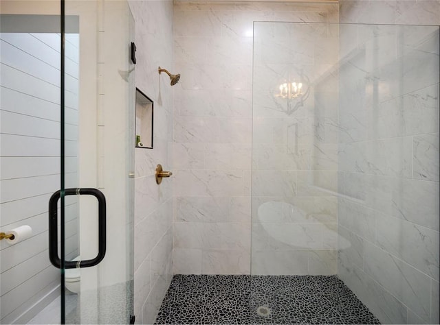 bathroom with a shower with shower door