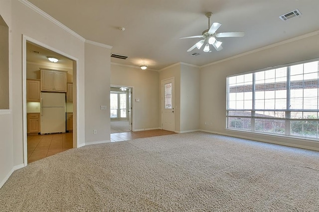 carpeted empty room with ceiling fan and ornamental molding