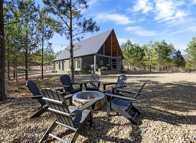 view of yard with a fire pit