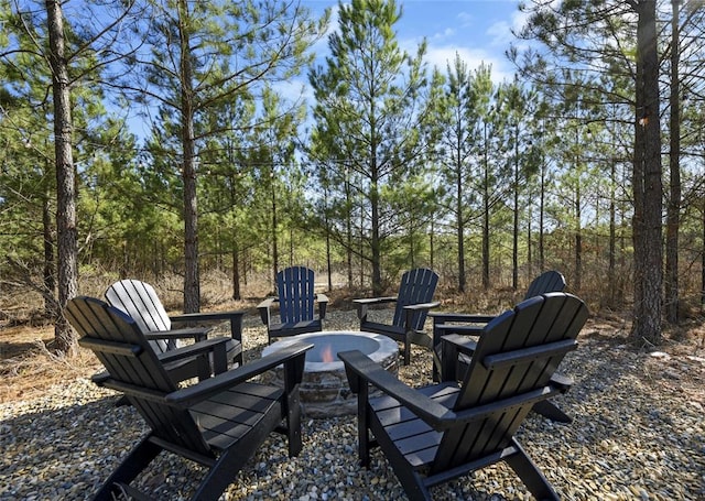 view of yard featuring an outdoor fire pit