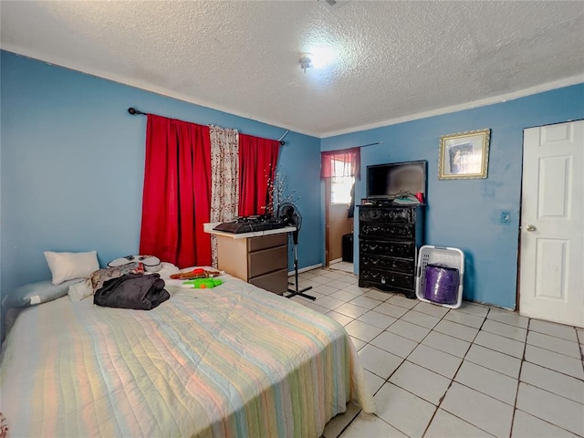 bedroom with light tile patterned floors and a textured ceiling