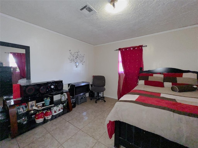 bedroom featuring tile patterned floors, a textured ceiling, and ornamental molding