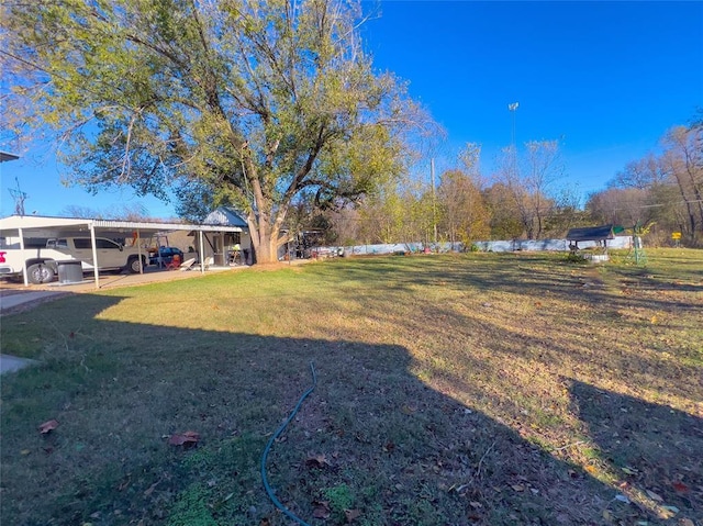 520 S Main St, Lexington, OK 73051 - view of grassy yard featuring a carport