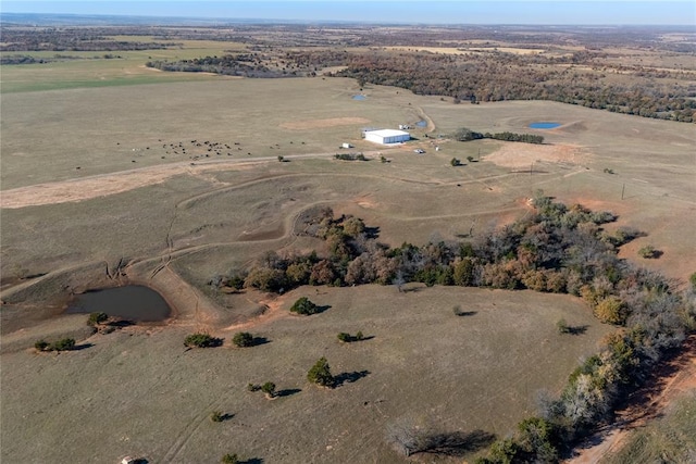 birds eye view of property with a rural view