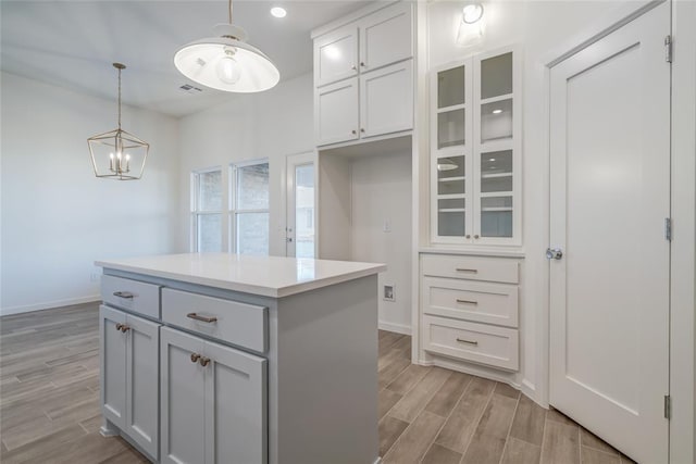 walk in closet featuring a chandelier