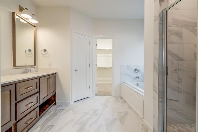 bathroom featuring vanity and separate shower and tub