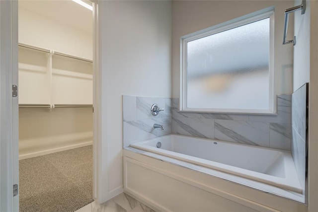 bathroom with a tub to relax in