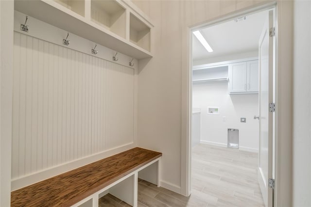 mudroom with light hardwood / wood-style flooring