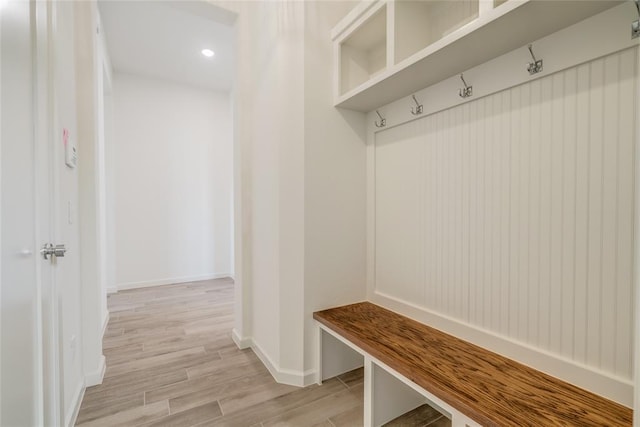 mudroom with light hardwood / wood-style flooring