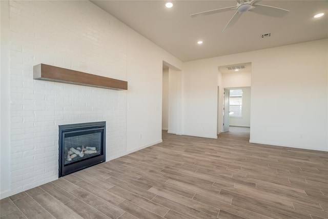 unfurnished living room featuring ceiling fan