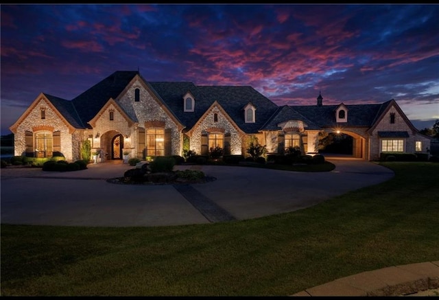 french country home with a yard