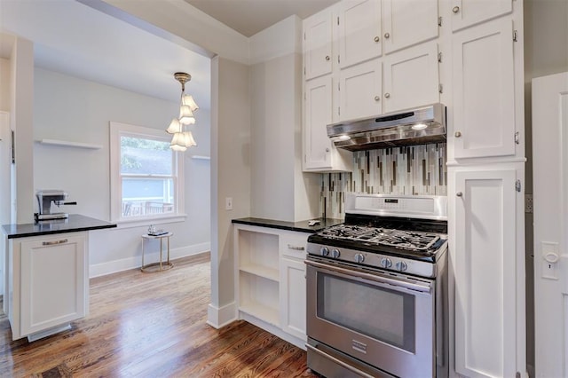 kitchen with pendant lighting, white cabinets, range hood, gas stove, and wood-type flooring