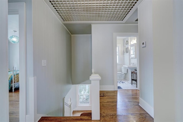 hall with hardwood / wood-style floors