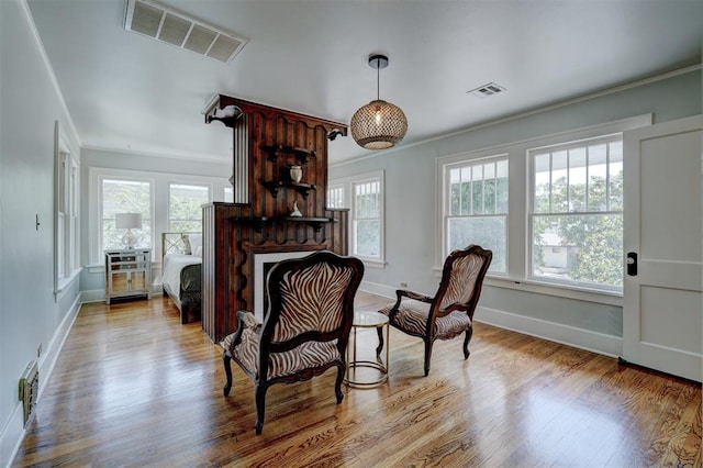 sitting room featuring light hardwood / wood-style floors and a fireplace