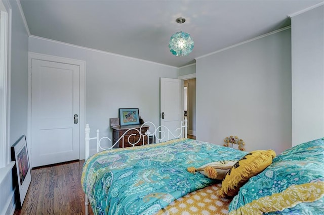 bedroom featuring dark hardwood / wood-style flooring and ornamental molding