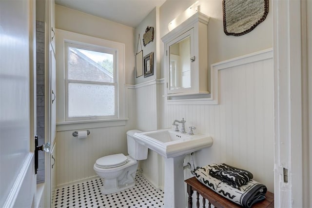 bathroom featuring tile patterned floors and toilet