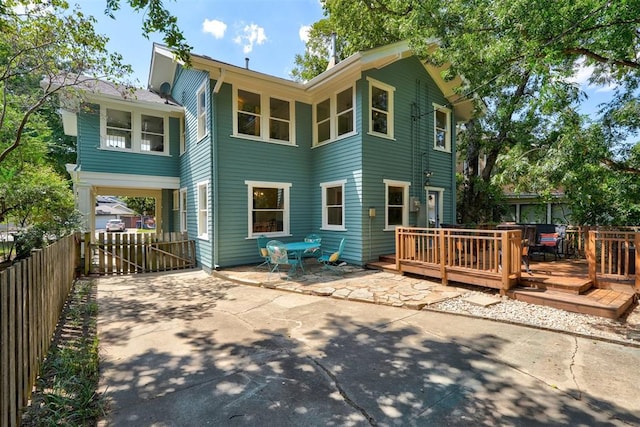 rear view of property with a deck