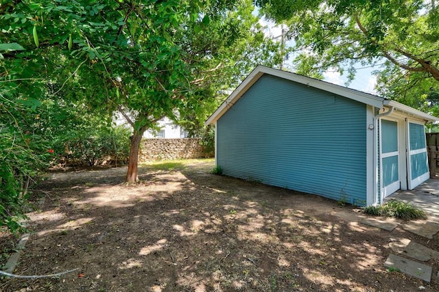 view of home's exterior featuring a storage shed