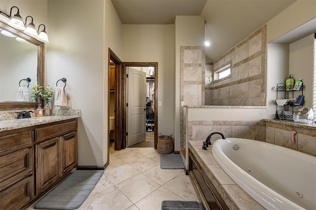 bathroom with plus walk in shower and vanity