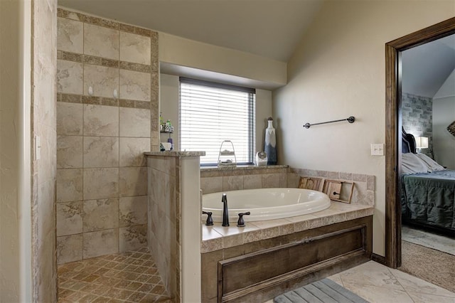 bathroom featuring lofted ceiling and shower with separate bathtub