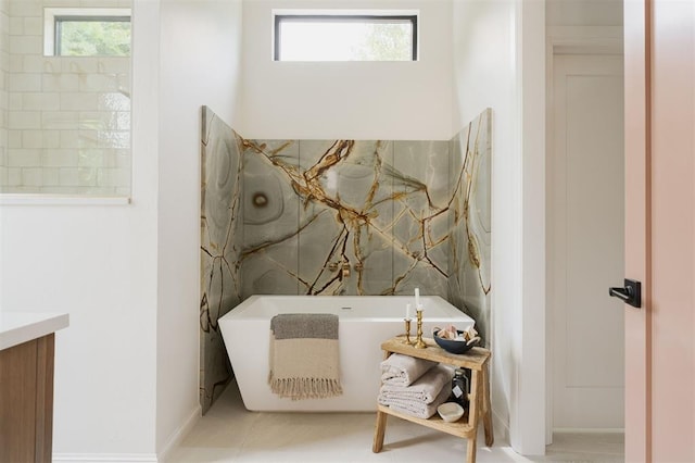 bathroom featuring tile patterned floors and a bathtub