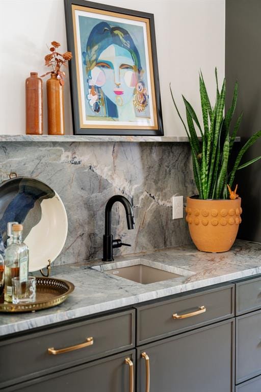 room details featuring sink and tasteful backsplash